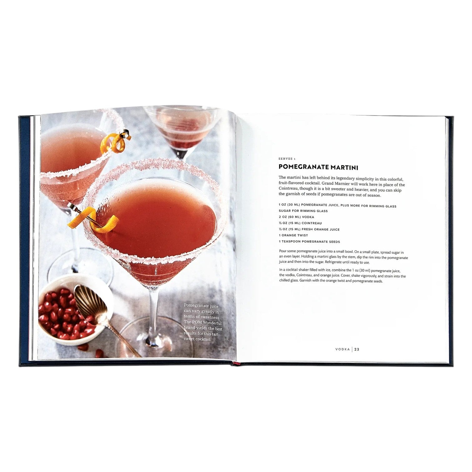 The Williams Sonoma: Cocktails book by Graphic Image displays mixology tips and a recipe for Pomegranate Martini, shown with a photo of two sugar-rimmed martinis garnished with orange twists—ideal inspiration for your home bar.