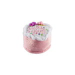 The Haute Diggity Dog Birthday Girl Toy is a small, plush pink and white cake slice with “Birthday Girl” embroidery and fabric flowers—a charming squeaky dog toy to celebrate your pup’s special day.