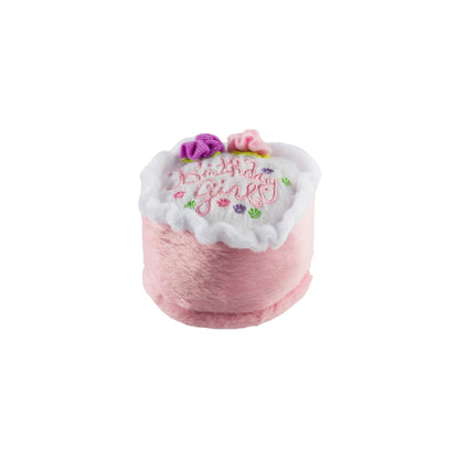 The Haute Diggity Dog Birthday Girl Toy is a small, plush pink and white cake slice with “Birthday Girl” embroidery and fabric flowers—a charming squeaky dog toy to celebrate your pup’s special day.