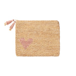 The Aerin Heart Raffia Zip Pouch is a rectangular beige woven clutch with a zipper and double tassel, featuring a pink heart in the lower left—an effortlessly stylish raffia bag perfect for casual use.