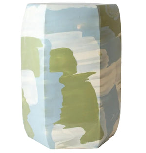 The Hexagonal Garden Stool by Paul Schneider Ceramics features abstract pattern variations in light blue, green, and white.