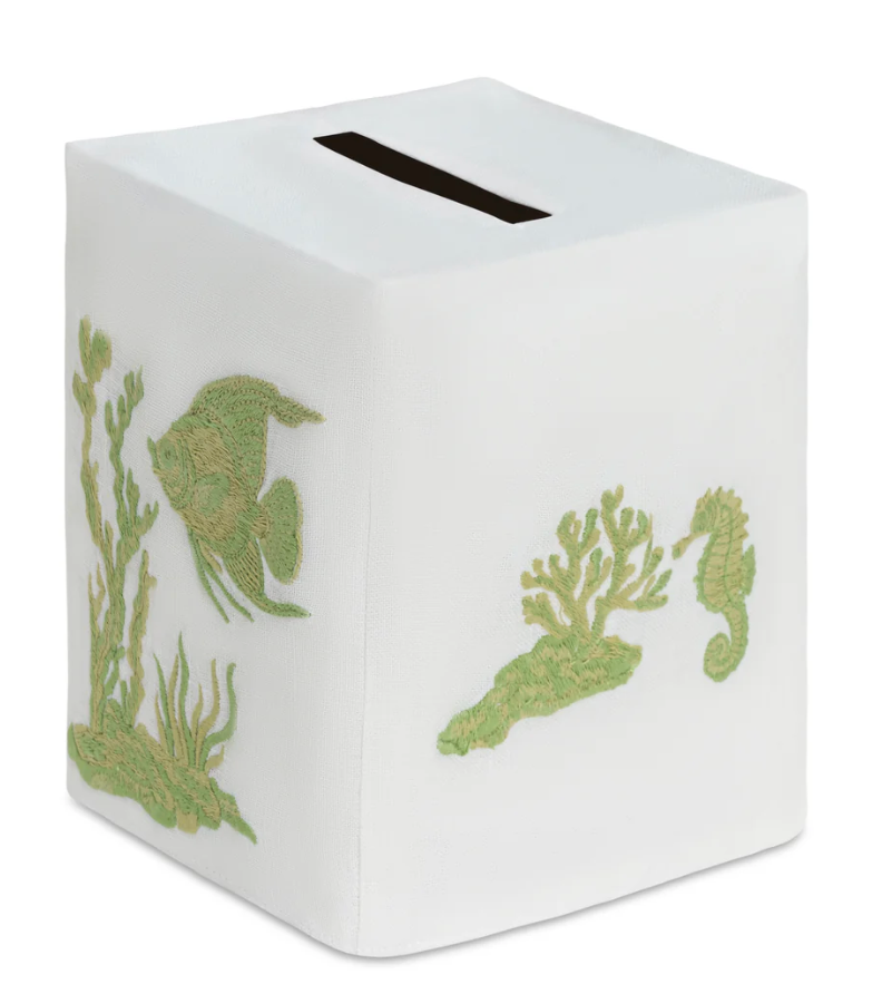 Deep Water Fish Bath Collection white square premium linen tissue box cover embroidered with green seaweed, coral, a fish, and a seahorse.