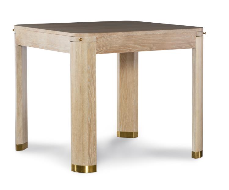 The Highland House Willie Oak Game Table features a square design with light legs, brass corner and foot accents, and a dark tabletop—bringing luxurious style to your game nights.