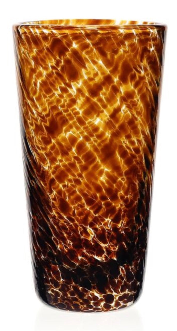 A tall cylindrical glass tumbler from the Vanessa Tortoise Collection by William Yeoward Crystal, featuring a mottled amber and brown pattern, a glossy finish, and exquisite glassmaking craftsmanship.