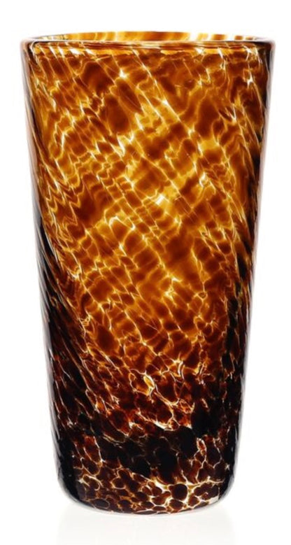 A tall cylindrical glass tumbler from the Vanessa Tortoise Collection by William Yeoward Crystal, featuring a mottled amber and brown pattern, a glossy finish, and exquisite glassmaking craftsmanship.