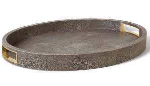 The Aerin Modern Shagreen Cocktail Tray in Chocolate features a round, textured surface with raised edges and two rectangular cutout handles on opposite sides.