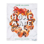 A wreath made of currant bread tied with a red ribbon surrounds the title of the Home Made Christmas cookbook.