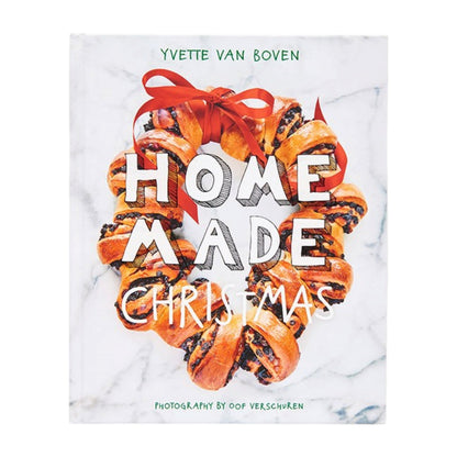 A wreath made of currant bread tied with a red ribbon surrounds the title of the Home Made Christmas cookbook.