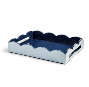 Addison Ross Scalloped Tray in Pale Denim & Navy features elegant wavy, scalloped edges with a high-gloss navy blue interior and a pale denim exterior. This tray includes cut-out handles on each side for easy carrying.