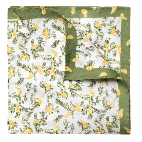 Square fabric with a green border and a banana pattern featuring green leaves. Made from 100% linen, the Eton Banana Pocket Square by Eton is partially folded to show both sides.