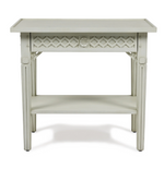 The Inge Side Table by Bunny Williams features a white wooden frame, decorative lattice design, lower storage shelf, and a charming hand-painted Swedish finish.