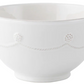 A white ceramic pasta bowl from the Juliska Berry & Thread Classic Whitewash Dinnerware Collection, featuring a raised dot and scalloped line design near the rim, is shown against a plain background.