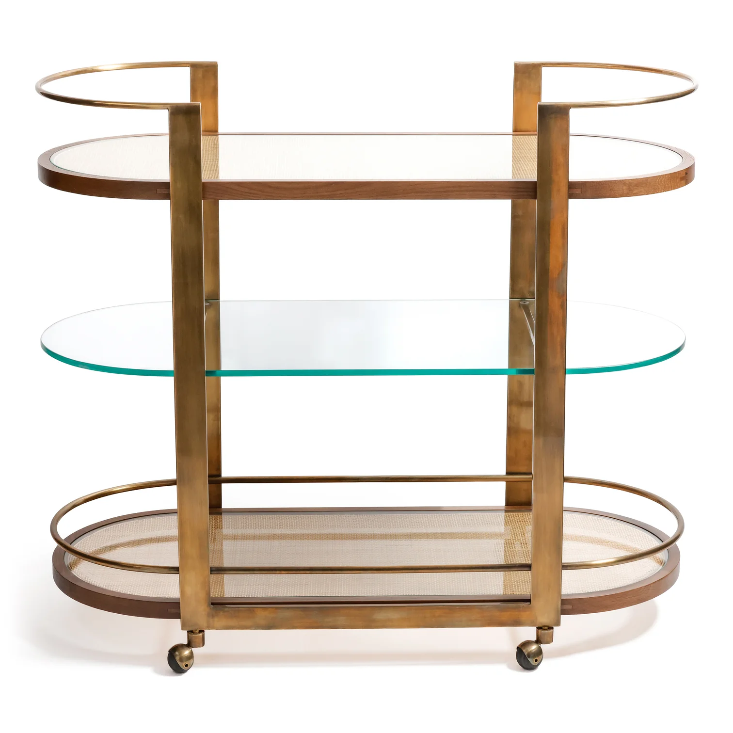 The Zodax Sloane Bar Cart features a brass frame, mesh top and bottom shelves, a glass middle shelf, and four wheels—ideal for showcasing cocktail accessories in your home bar.