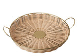 The Rowan Basket Collection by Be Home features round, woven cane wicker baskets handcrafted in India with a flat base, gold metal side handles, and a central metal disk. Made from sustainable natural materials for an eco-friendly touch.