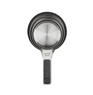 Three nested Cuisinart Magnetic Measuring Cups, including a "1/4 cup 59 ml" size with branded handle, are shown on a white background. These dishwasher safe stainless steel cups offer convenience and durability.