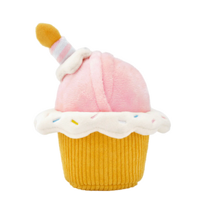 The Foggy Dog Cupcake 2-in-1 Bounce Dog Toy features pink frosting, white sprinkles, a yellow candle, plus squeaker and crinkle paper for extra fun. Perfect for dogs who love interactive birthday-themed play!.