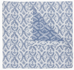 Part of the John Robshaw Aashna Azure Bedding Collection, this square cotton jacquard napkin displays a blue floral and vine motif on white, folded to reveal a contrasting blue design inspired by Portuguese tilework.