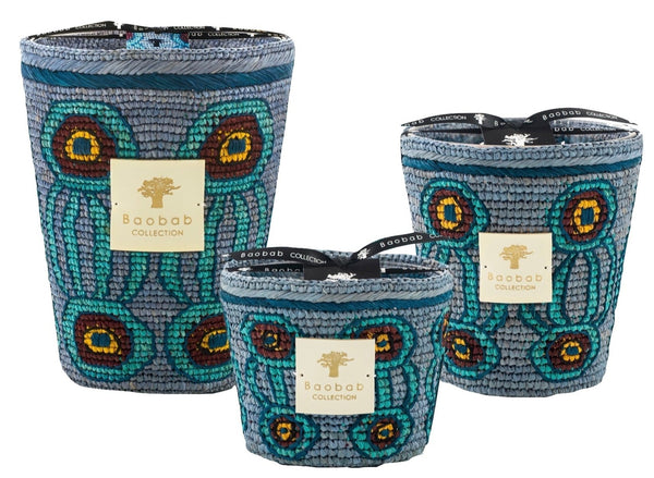Three decorative, scented candles from the Baobab Collection Doany Ikaloy by Baobab, featuring colorful beaded designs with lids, arranged by size.