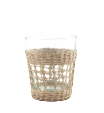 The Be Home Seagrass Cage Glassware Collection features clear glass cups with woven seagrass sleeves, perfect for stylish cocktails or bringing artisanal flair to your drinkware.