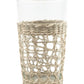 The Be Home Seagrass Cage Glassware Collection features clear glass tumblers partially wrapped in woven seagrass—ideal for cocktails or bringing a stylish touch to your everyday drinkware.