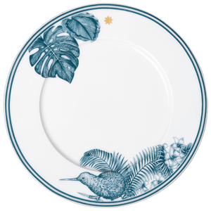 The Paraiso Blue Collection plate by Furstenberg features blue tropical leaves, flowers, a kiwi bird, and a gold star near the rim—expertly crafted from high-quality materials for elegant tableware with exceptional artistry.