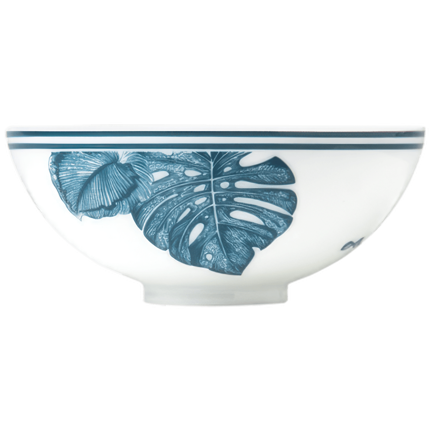 The Furstenberg Paraiso Blue Collection features a white ceramic bowl with a blue monstera leaf design and double blue rim lines, combining fine craftsmanship to enhance any tableware collection.