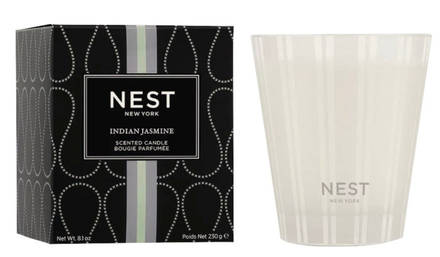 A Nest Indian Jasmine Classic Candle in a glass container with elegant packaging, crafted from premium wax and displayed side by side.