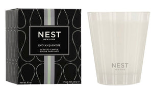 A Nest Indian Jasmine Classic Candle in a glass container with elegant packaging, crafted from premium wax and displayed side by side.