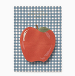 A notepad from the Rifle Paper Co. Schoolhouse Collection featuring an apple-shaped sticky note on a blue and white checkered background—perfect for desk supplies or thoughtful teacher gifts.