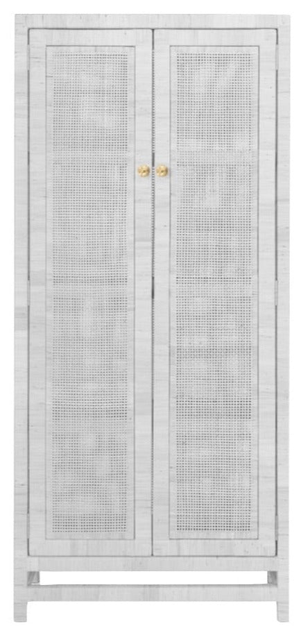 The Isla Cabinet in White Rattan by Made Goods showcases a tall design with natural peeled rattan in a basket weave pattern and is highlighted by double doors with elegant gold knobs.