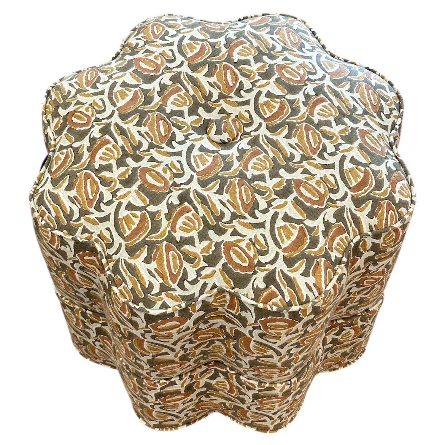 The Bunny Williams Stella Stool features scalloped edges and is upholstered in a patterned fabric with brown, beige, and olive green leaf designs—ideal as a stylish foot rest.