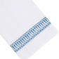 Paris Bath Accessories white premium linen towel featuring a blue embroidered cutout border.