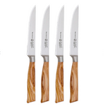 Four Oliva Elite Fine Edge Steak Knives by Messermeister, each with a wooden handle and German stainless steel blade, are arranged upright in a row on a white background.