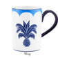 White porcelain mug with blue handle, rim, and palm tree design. From the handcrafted Jaipur Blue Dinnerware Collection by Aquazzura Casa, featuring "Mug" printed under the cup.