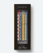 A boxed set of four gel pens from the Rifle Paper Co. Schoolhouse Collection, featuring playful designs—apples, flowers, ruler markings, and blue gingham. A charming addition to your desk supplies or a thoughtful teacher gift inspired by classic schoolhouse style.