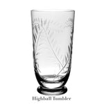 Handmade clear glass highball tumbler from the William Yeoward Crystal Jasmine Drinkware Collection, featuring a hand-engraved leaf pattern and solid, raised base. Displayed on white background, ideal for any occasion.