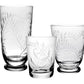 The Jasmine Collection by William Yeoward Crystal features three clear glasses of different heights, each with etched leaf patterns, elegantly displayed as luxurious handmade glassware for sophisticated table settings.
