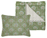 The Jeeva Sage Bedding Collection by John Robshaw features a hand-quilted sage green cotton voile quilt and pillow with a white floral pattern and a smaller repeating print on the reverse.