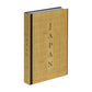 Japan: The Cookbook" by Phaidon is a hardcover featuring authentic Japanese recipes, a gold cover, and line patterns.