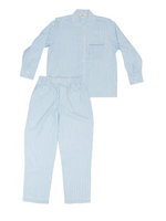 The Nandi Light Indigo Pajama Set by John Robshaw, shown laid flat on a white background, features a light blue and white striped long-sleeve top with a front pocket and matching elastic-waist pants, both crafted from soft 200 thread count organic cotton percale.