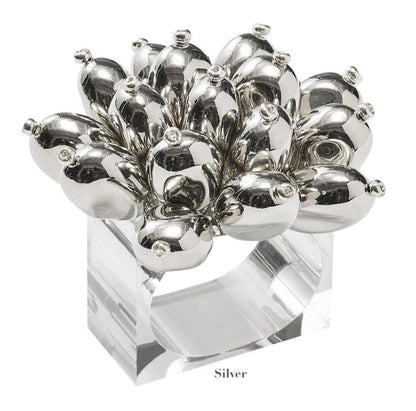 The Jubilee Napkin Ring by Kim Seybert features a cluster of shiny, silver bulb-shaped ornaments on a clear square band—ideal for festive occasions or elevating your table setting. Labeled "Silver" below.