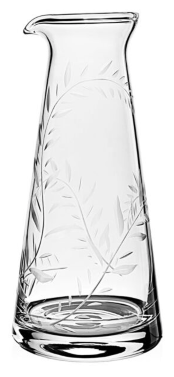 The William Yeoward Crystal Jasmine Juice Carafe features clear glass with an etched leafy vine and jasmine pattern, a tapered body, and a spout—an elegant wedding gift choice.