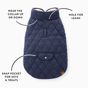The Foggy Dog Navy Sherpa-Lined Reversible Dog Jacket, Large, is shown on a white background with labeled features like adjustable collar, snap pocket, leash hole, and cozy sherpa lining.