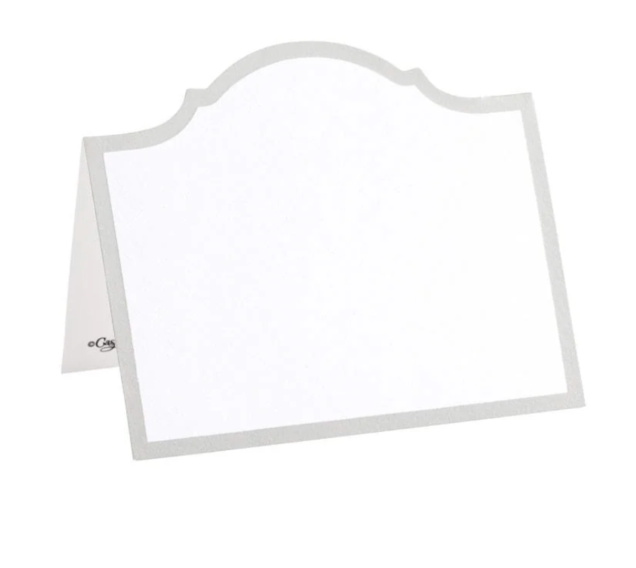 The Caspari Arch Silver Place Cards feature a folded white design with a silver border and scalloped top edge, standing upright on a white background—ideal for elegant table decor.