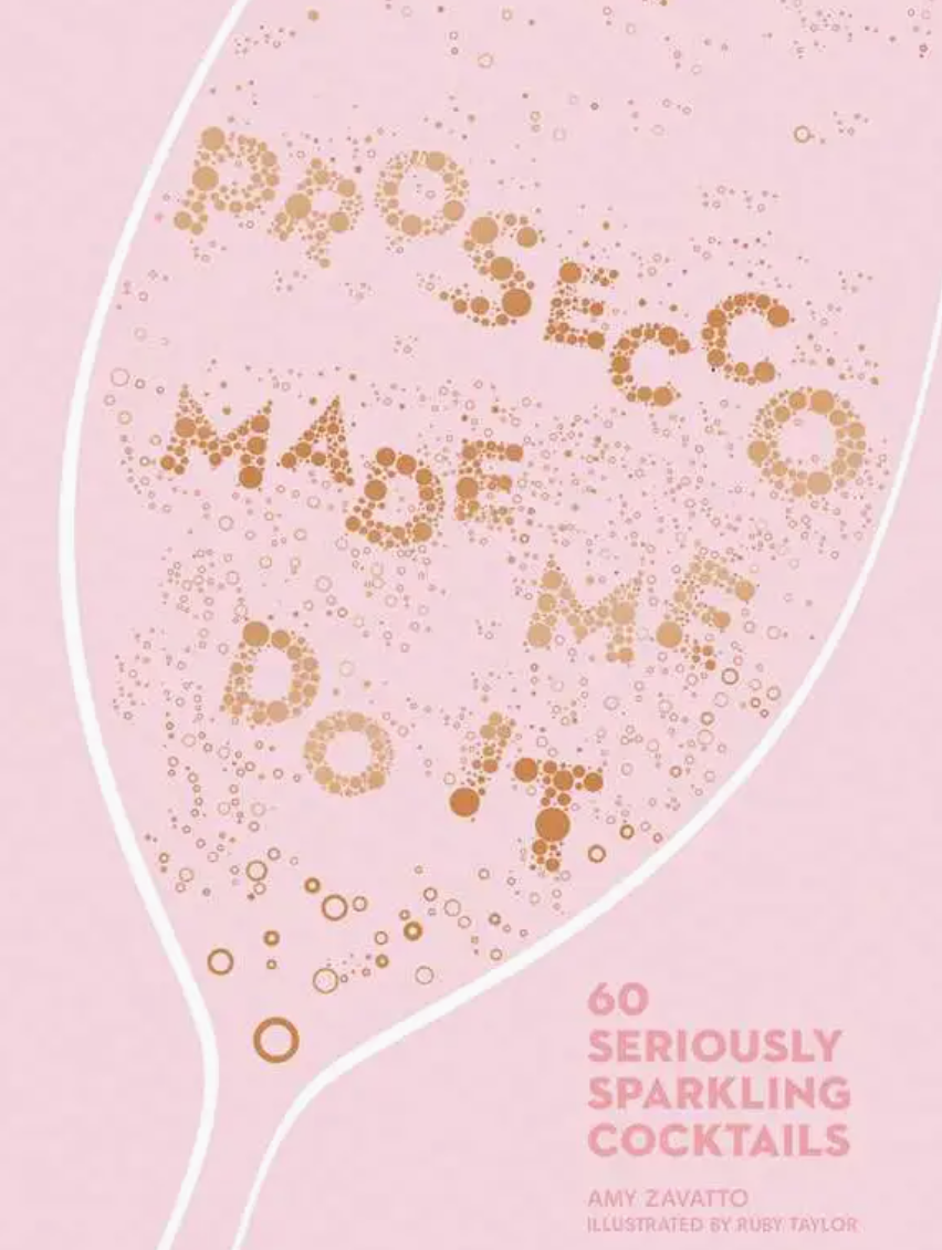The “Prosecco Made Me Do It” book by Simon & Schuster features a pink cover with a champagne glass illustration, displaying the phrase “Prosecco made me do it” inside and “60 Seriously Sparkling Cocktails” at the bottom right—ideal for prosecco enthusiasts and fans of bubbly cocktail recipes.