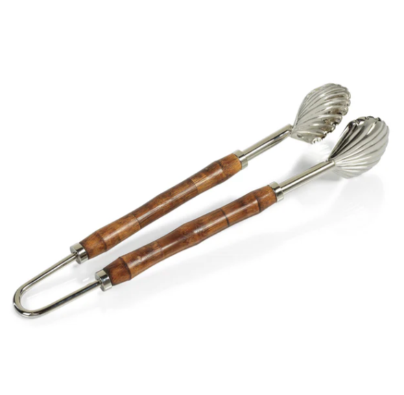 The Colony Bamboo and Nickel Serving Sets by Zodax feature metal tongs with bamboo handles and scalloped stainless steel ends—an elegant addition to any serving set.