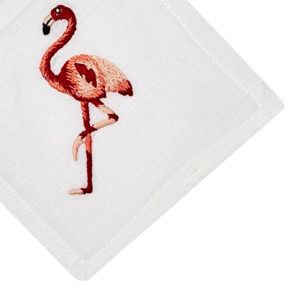 Experience the Flamingo Coaster & Bath Collection by Haute Home—a premium white linen napkin adorned with an embroidered pink flamingo standing gracefully on one leg.