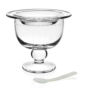 The William Yeoward Crystal Katerina Crystal Caviar Server with Spoon features an elegant clear glass bowl with a rounded stem and wide rim, shown beside a small white spoon on a plain white background.
