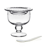 The William Yeoward Crystal Katerina Caviar Server for 2 features clear crystal with a wide rim and small pedestal base, paired with a white spoon, shown on a plain white background—perfect for stylish caviar presentation.