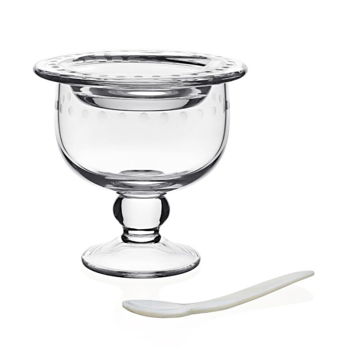 The William Yeoward Crystal Katerina Caviar Server for 2 features clear crystal with a wide rim and small pedestal base, paired with a white spoon, shown on a plain white background—perfect for stylish caviar presentation.